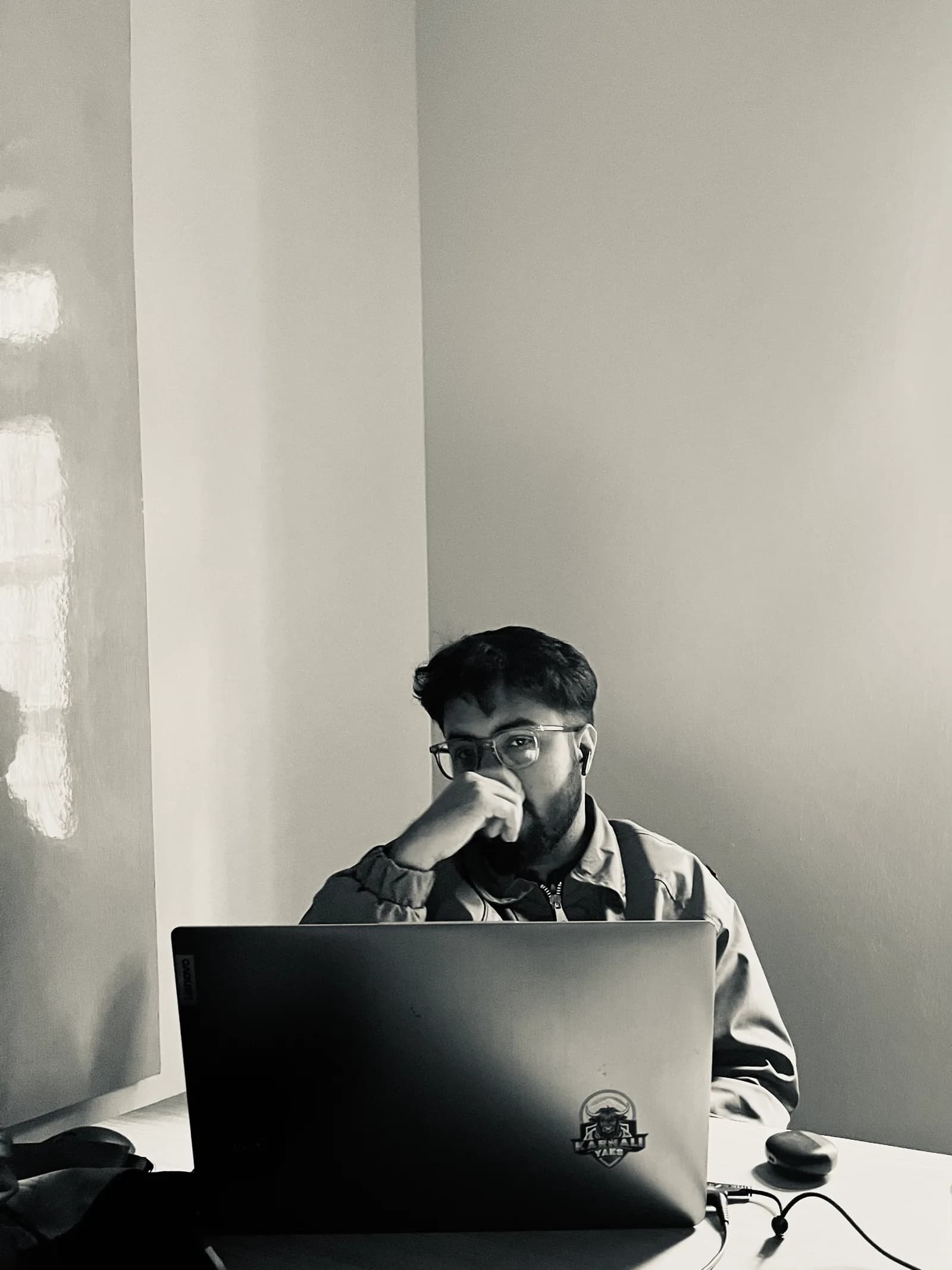Janak Pokharel working on a laptop