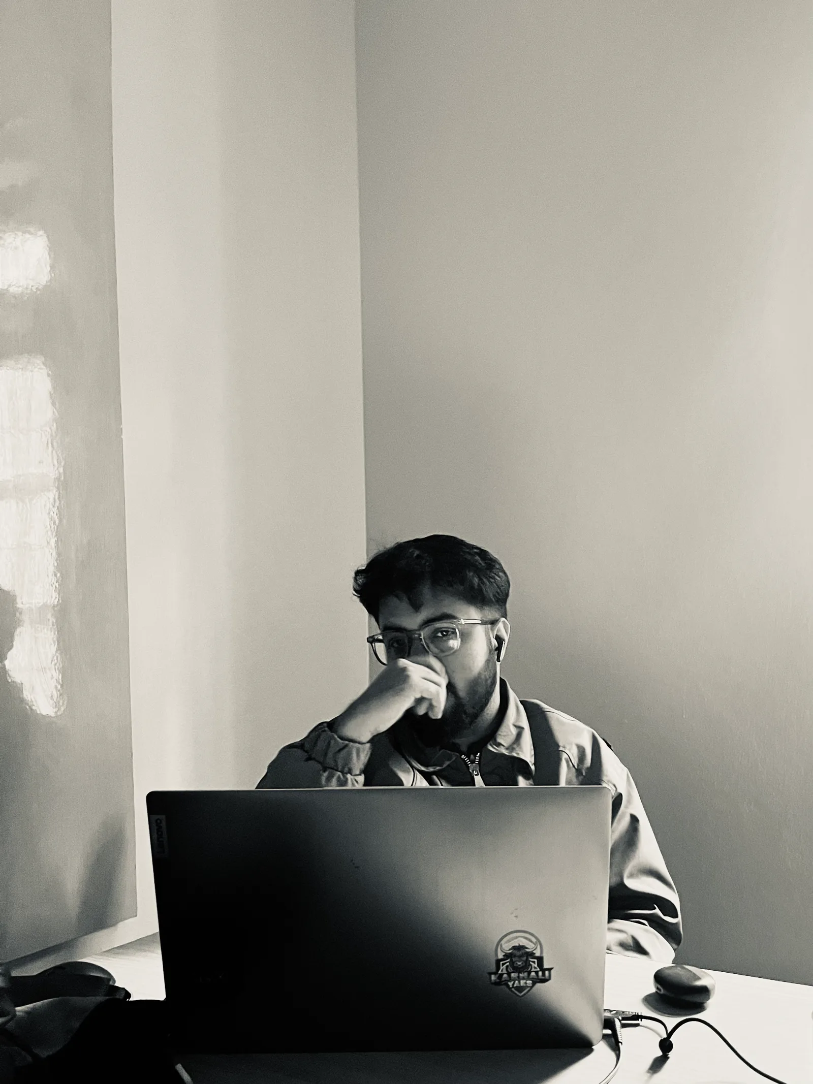 Janak Pokharel working on a laptop